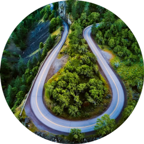 curving road on a green mountain top